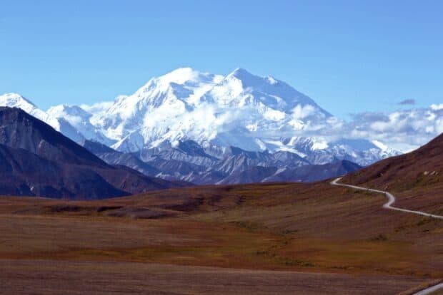 A winding road leads through the valley under the snow covered Denali mountain, HD Desktop Wallpaper