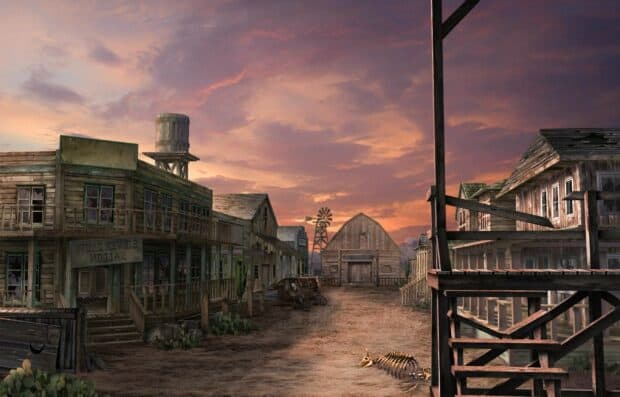 A deserted western ghost town with old wooden buildings and a dramatic sunset sky, 2K Desktop Wallpaper