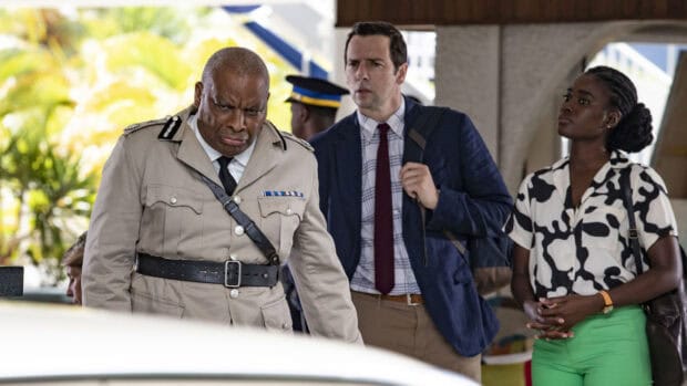 The Death In Paradise TV series team carefully inspects a crime scene together, HD Desktop Wallpaper