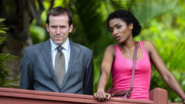 Two detectives are standing on a balcony discussing a case in Death In Paradise TV series, HD Desktop Wallpaper