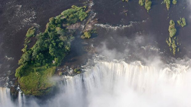 Aerial view of Devils Pool Zambia showing the waterfall and surrounding greenery, HD Desktop Wallpaper