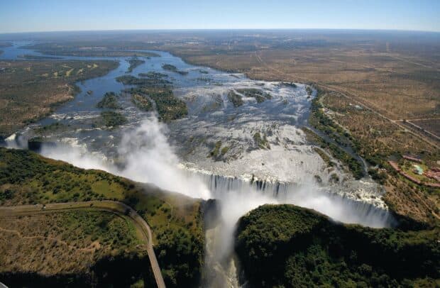 The Devils Pool in Zambia shows cascading water and lush green surroundings, HD Desktop Wallpaper