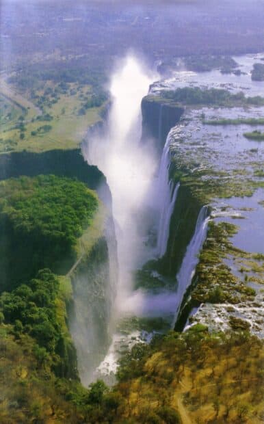 A breathtaking view of Devils Pool Zambia with cascading water and surrounding lush greenery, HD Mobile Wallpaper