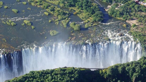 Aerial view of Devils Pool Zambia with lush greenery and flowing water, HD Desktop Wallpaper