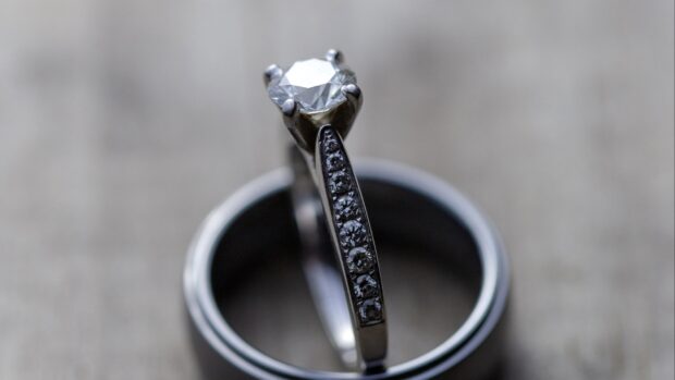A close up of a diamond ring with small stones showcasing wedding ring wallpapers, 4K Desktop Wallpaper