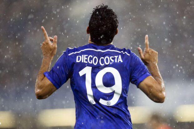 Diego Costa celebrates with his arms raised in rain during a match, HD Desktop Wallpaper