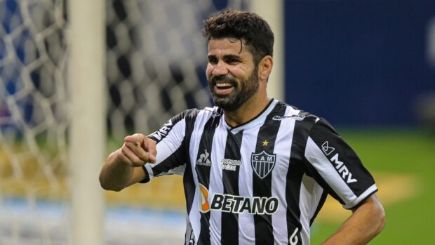 Diego Costa is smiling and pointing during a football match, HD Desktop Wallpaper