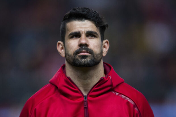 Diego Costa looks thoughtful before the match in a red jacket, HD Desktop Wallpaper