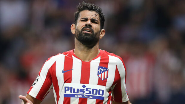 Diego Costa shows a frustrated expression during a football match wearing Atletico Madrid kit, HD Desktop Wallpaper