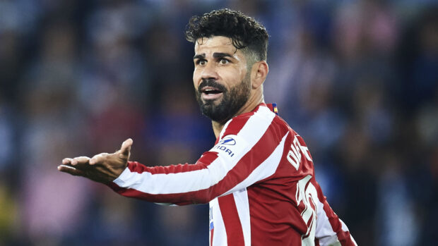 Diego Costa expresses frustration during the match wearing Atlético Madrid striped jersey, HD Desktop Wallpaper