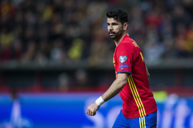 Diego Costa is focused during a football match wearing the Spain national team jersey, HD Desktop Wallpaper