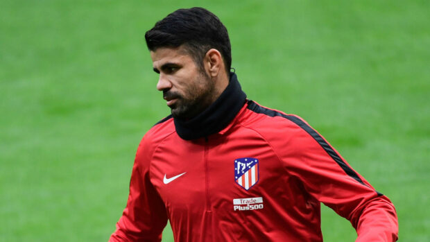 Diego Costa in a red jacket practicing on grass field, HD Desktop Wallpaper