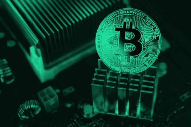 A digital Bitcoin coin is placed on a computer circuit board representing cryptocurrency technology, HD Desktop Wallpaper