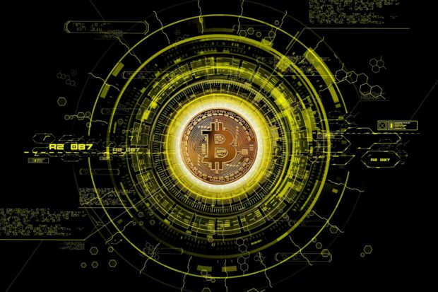 A digital Bitcoin currency symbol surrounded by futuristic tech elements, HD Desktop Wallpaper