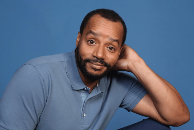 Donald Faison casually posing with a thoughtful expression, HD Desktop Wallpaper