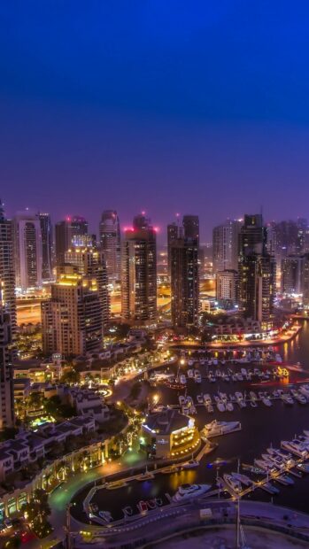 The Dubai Marina illuminated with yachts and skyscrapers in United Arab Emirates, HD Mobile Wallpaper