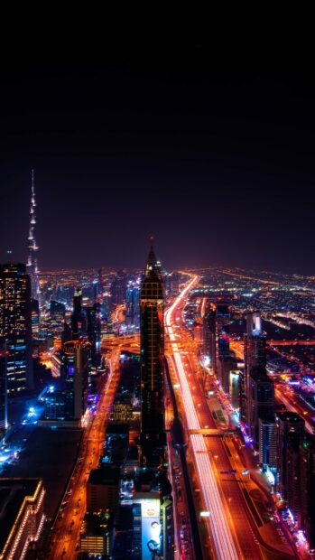 Dubai cityscape at night with glowing lights showcasing United Arab Emirates Wallpapers, 4K Mobile Wallpaper