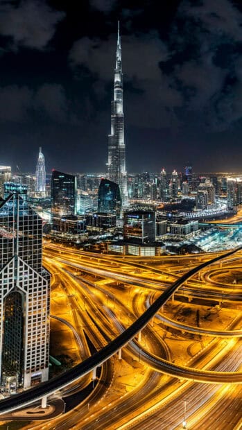 The United Arab Emirates Wallpapers show the vibrant night view of Dubai's downtown and highways, 2K Mobile Wallpaper