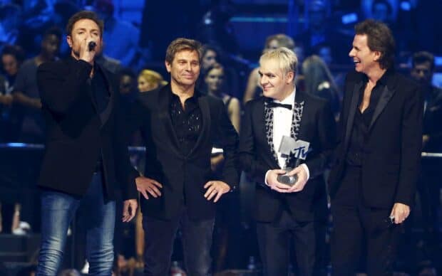 Duran Duran Wallpapers show the band receiving an award while performing on stage, HD Desktop Wallpaper