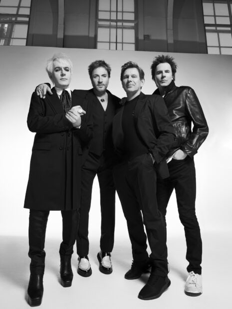 The Duran Duran band poses together in stylish black suits and shoes, HD Phone Wallpaper