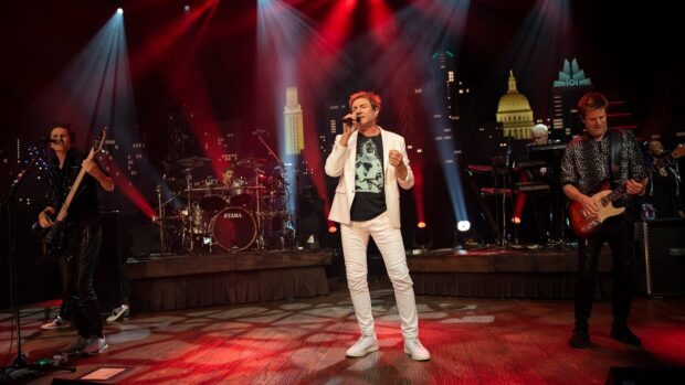 Duran Duran performs on stage with vibrant lighting and instruments, HD Desktop Wallpaper