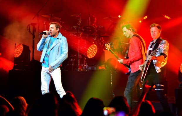 Duran Duran Wallpapers featuring the band performing with colorful lights on stage, HD Desktop Wallpaper