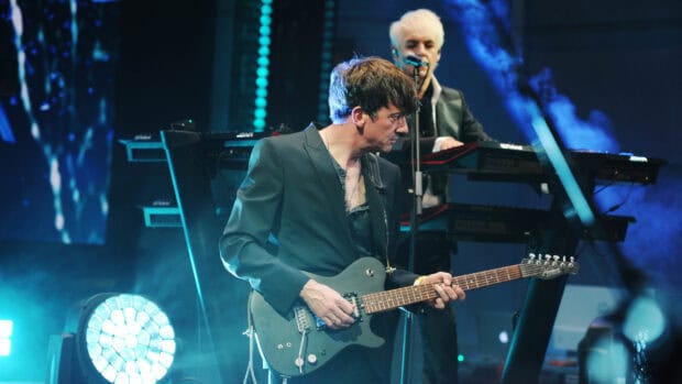 Duran Duran performs live with guitar and keyboard in a concert, 2K Desktop Wallpaper