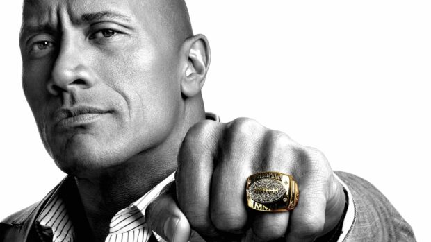Dwayne Johnson shows a detailed championship ring on his fist in a close up black and white portrait, HD Desktop Wallpaper