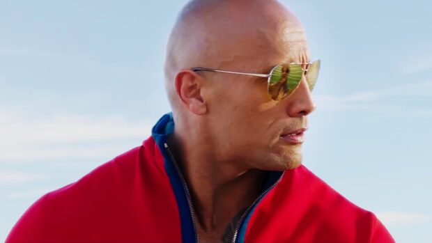Dwayne Johnson wears reflective sunglasses in a Baywatch movie scene, HD Desktop Wallpaper