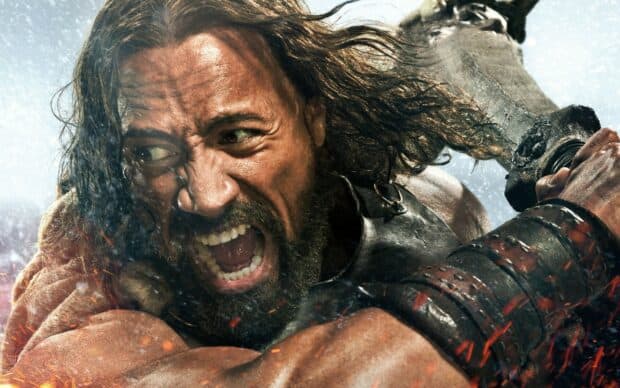 Dwayne Johnson fiercely battling with a large weapon in a stormy environment, 2K Desktop Wallpaper