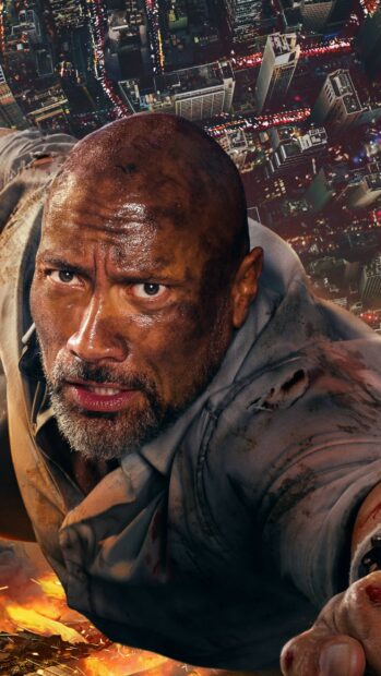 Dwayne Johnson is climbing with determination over a burning cityscape, 2K Phone Wallpaper