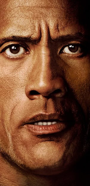 A close up of Dwayne Johnson's intense face showing detailed skin texture, 2K Phone Wallpaper
