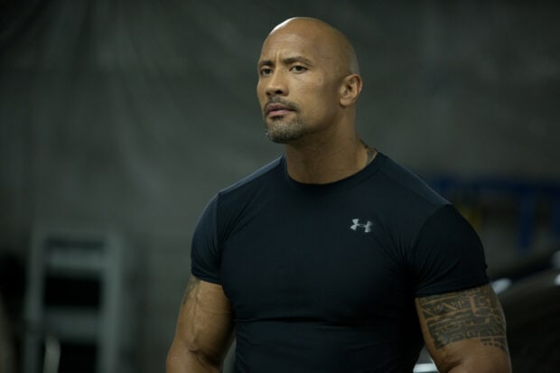 Dwayne Johnson has an intense expression while wearing a black Under Armour shirt, HD Desktop Wallpaper