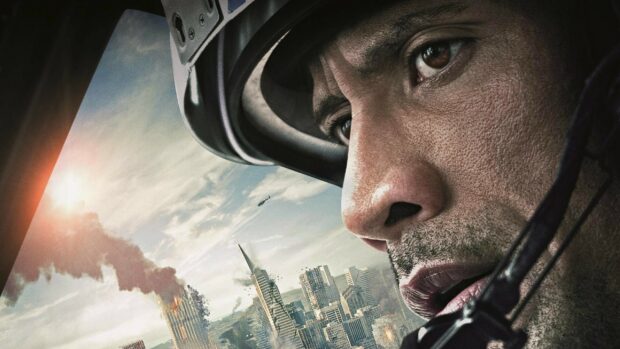 Dwayne Johnson wallpapers showing a close up of his intense face with a city under attack in the background, 2K Desktop Wallpaper