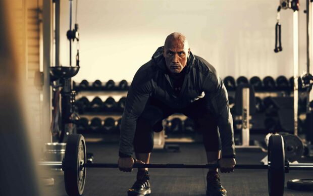 Dwayne Johnson is preparing to lift a heavy barbell during his workout session, 2K Desktop Wallpaper