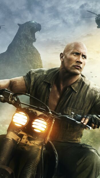 Dwayne Johnson riding a motorcycle with a roaring beast statue behind him in a dramatic sky, 4K Mobile Wallpaper