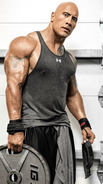 Dwayne Johnson is lifting weights and preparing for a workout session, 2K Mobile Wallpaper