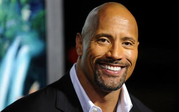 Dwayne Johnson smiles warmly wearing a black suit at an event, 2K Desktop Wallpaper