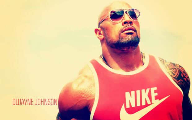 A muscular man named Dwayne Johnson is wearing sunglasses and a red Nike tank top under bright sunlight, HD Desktop Wallpaper