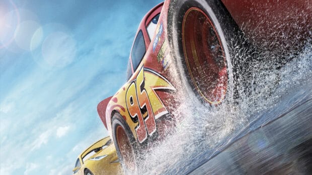 The Pixar wallpapers show racing cars speeding on a wet track under a cloudy sky, 4K Desktop Wallpaper