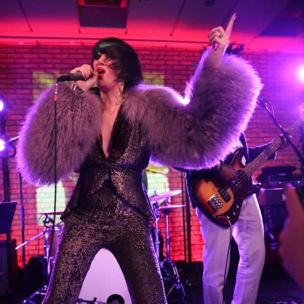 The Yeah Yeah Yeahs perform live with high energy on stage, HD Desktop Wallpaper