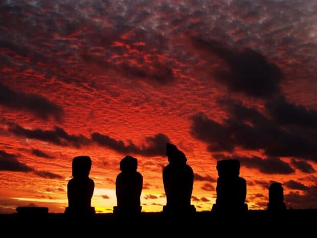 Silhouettes of Easter Island Moai statues under a dramatic red sunset sky, HD Desktop Wallpaper