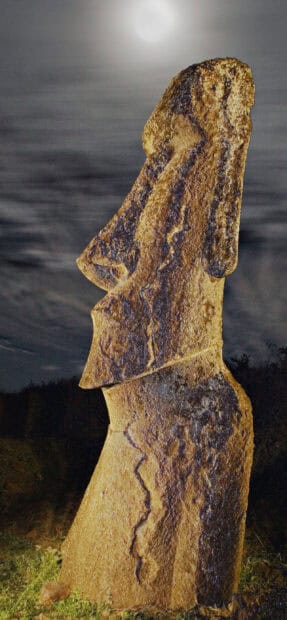 A close up of an Easter Island statue illuminated under the night sky, 2K Mobile Wallpaper