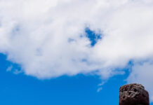 The Easter Island statues stand tall against a bright blue sky with scattered clouds, HD Phone Wallpaper