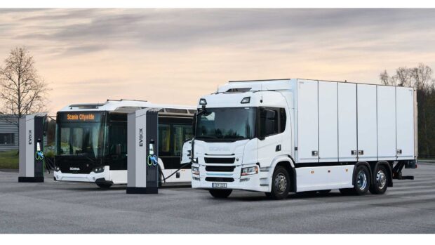 An electric Scania truck and bus are parked side by side while charging at a station, HD Desktop Wallpaper