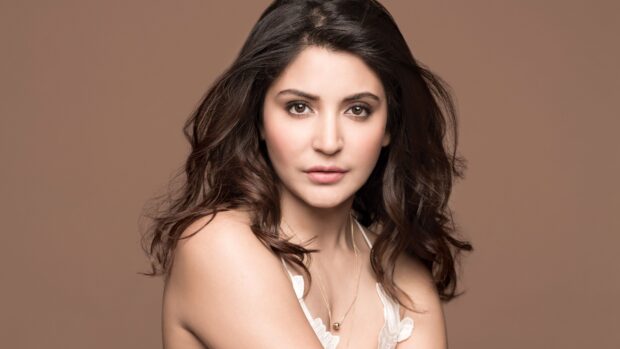 A close up portrait of a Bollywood actress with neutral makeup and wavy hair, 4K Desktop Wallpaper