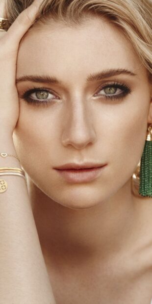 A close up portrait of Elizabeth Debicki wearing green earrings and gold bracelets, HD Mobile Wallpaper