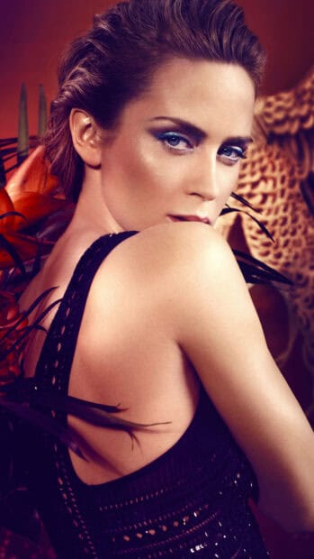 A close up portrait of Emily Blunt with striking eye makeup and elegant pose, HD Phone Wallpaper