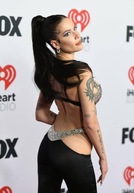 Halsey poses confidently in a stylish outfit showing her tattoos, 2K Mobile Wallpaper