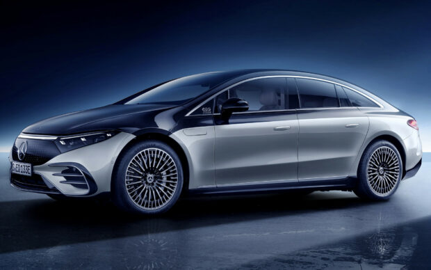 A sleek Mercedes Benz EqS electric car is shown in a studio setting with a reflective floor, HD Desktop Wallpaper